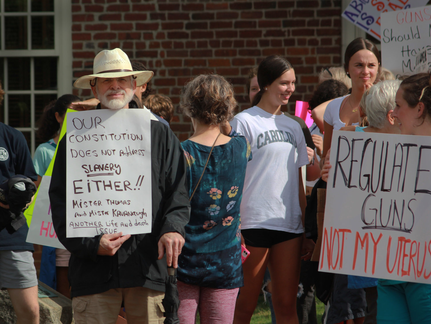 People of all genders participate in the abortion and women’s rights protest on Monday at the Historic Courthouse in Pittsboro. The storms from earlier in the day had subsided just in time for the protest.